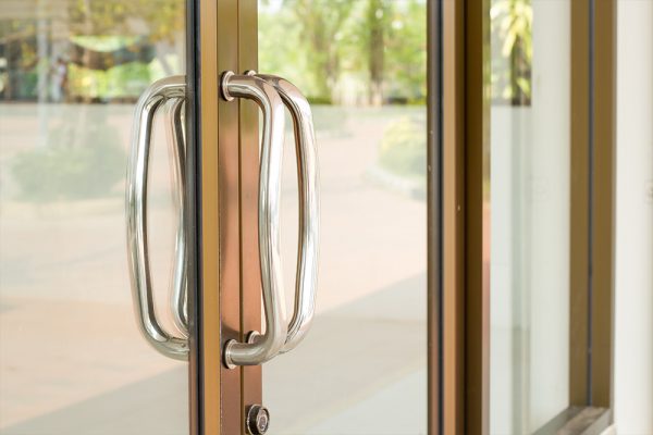 Style door handle on natural wooden door, door handle element